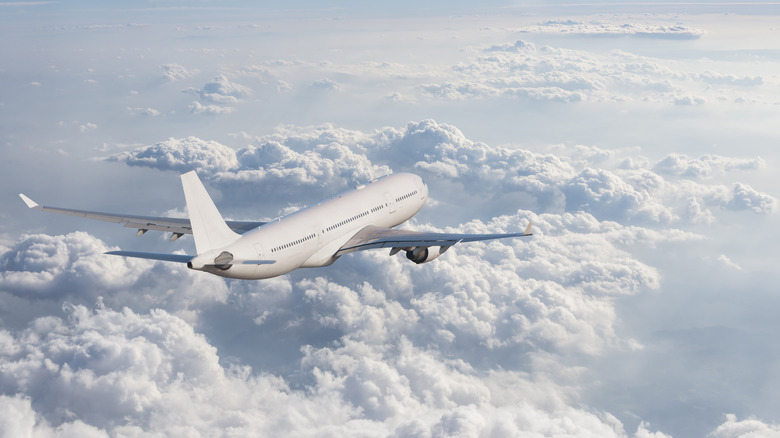 White airplane in sky 