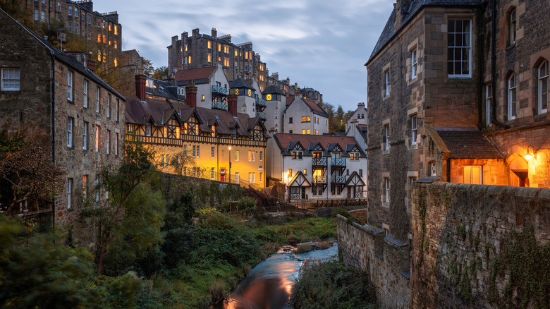 Scotland's Dean Village buildings with lights on at dusk