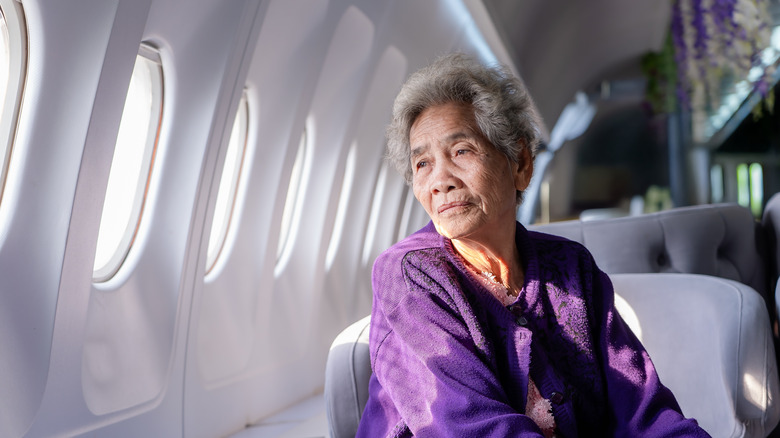 elderly woman on plane