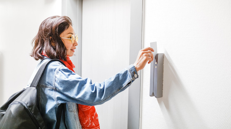 Traveler using keycard to unlock door