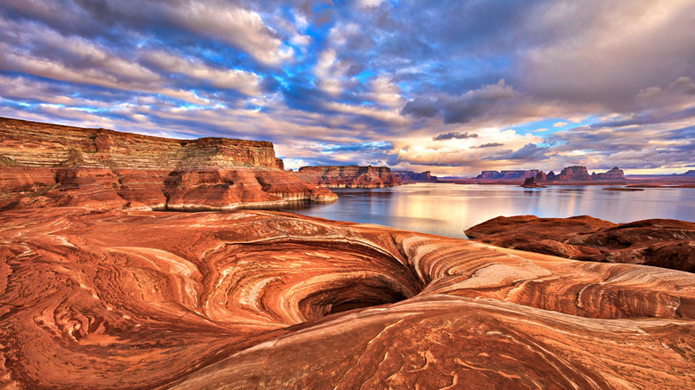 lake surrounded by red rocks