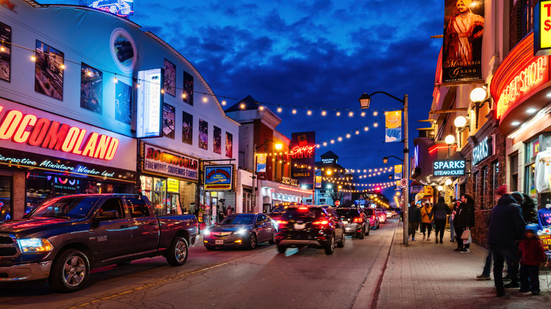 Cars and pedestrians share a street in downtown Niagara Falls