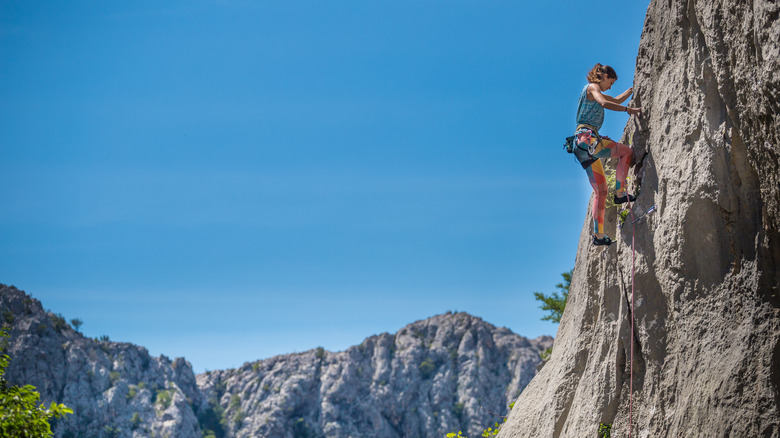 Woman rock climbing in Paklenica