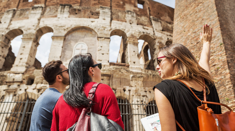 Tourist looking up Coliseum 