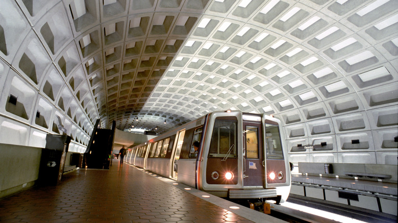 A commuter train arrives at a platform in the Washington, D.C. Metro