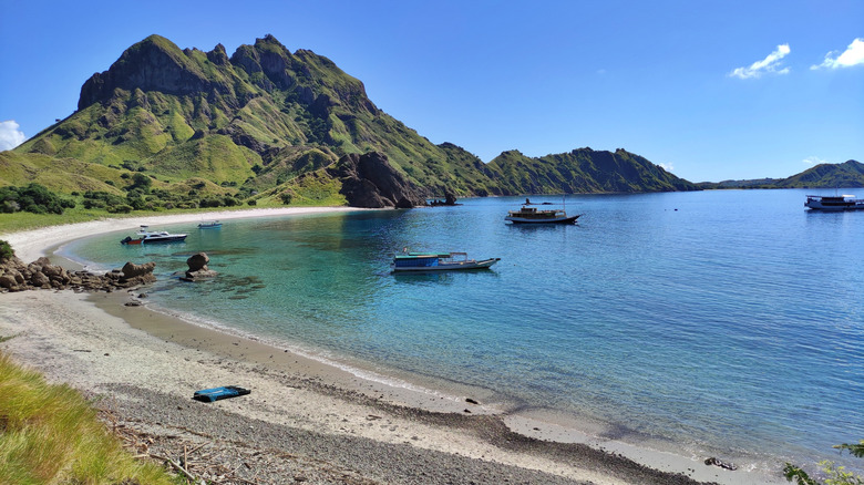 people at Padar Island relaxing and enjoying the nature