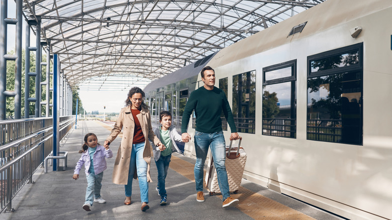 A family at a train station.