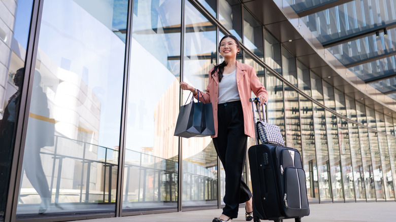 woman with bags at airport