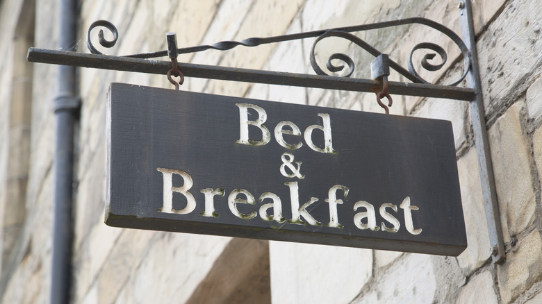 Hanging bed and breakfast sign
