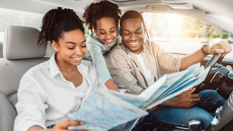 family reading a map