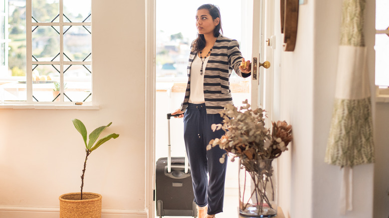 woman arriving at Airbnb