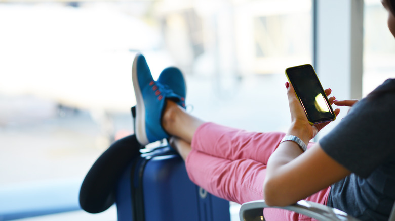 person sitting at airport