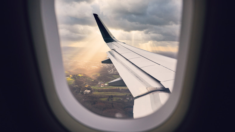 seat with airplane wing view