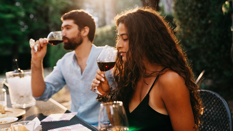 Man and woman drinking wine