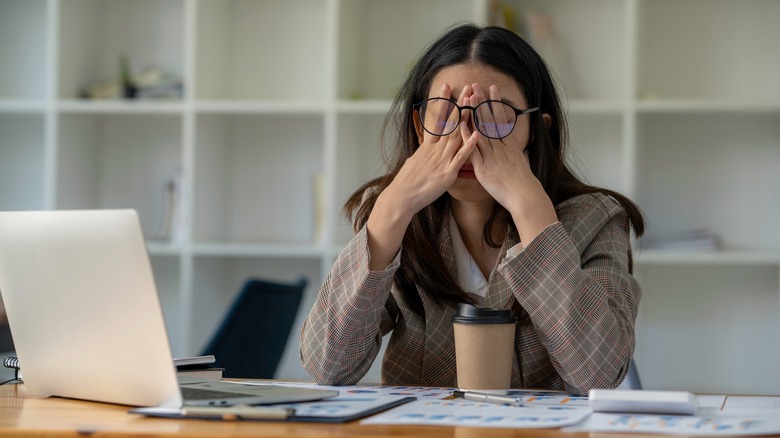 frustrated woman sitting at desk