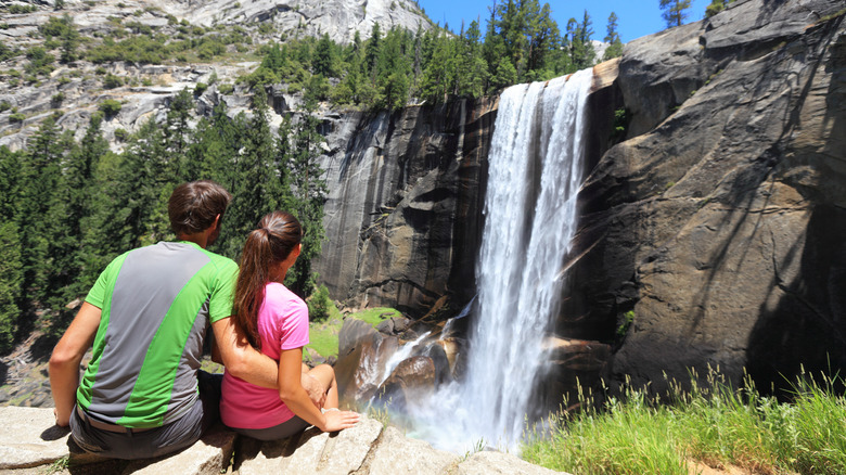 couple sitting at vernal falls