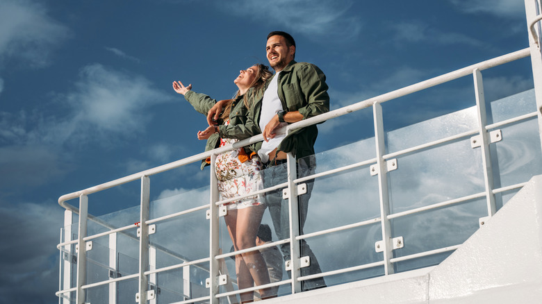 happy couple on cruise deck