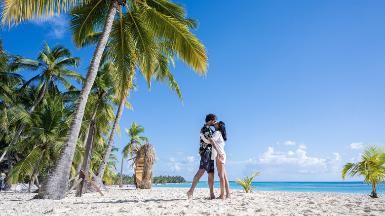 happy tourists on beach in Punta Cana