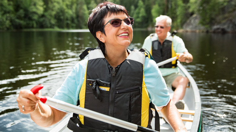 older couple kayaking 